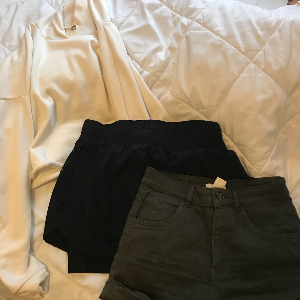 White sweatshirt, black shorts , green shorts!